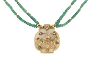 An Indian gem set pendant necklace, the shaped hardstone panel applied with a frieze of stylised
