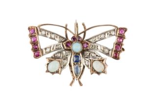 A vari gem-set butterfly brooch, the outstretched openwork wings edged with circular mixed-cut