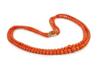 A collection of coral jewellery, comprising a coral corallium rubrum graduated double strand bead