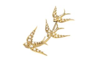 A half pearl bird brooch, modelled as a trio of swallows in flight, each highlighted with