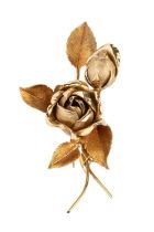 An 18ct gold floral spray brooch, of part-textured design, naturalistically modelled as a spray of