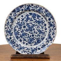 Delft Chinese style charger 18th Century painted with typical Kangxi style flower sprays, 35cm