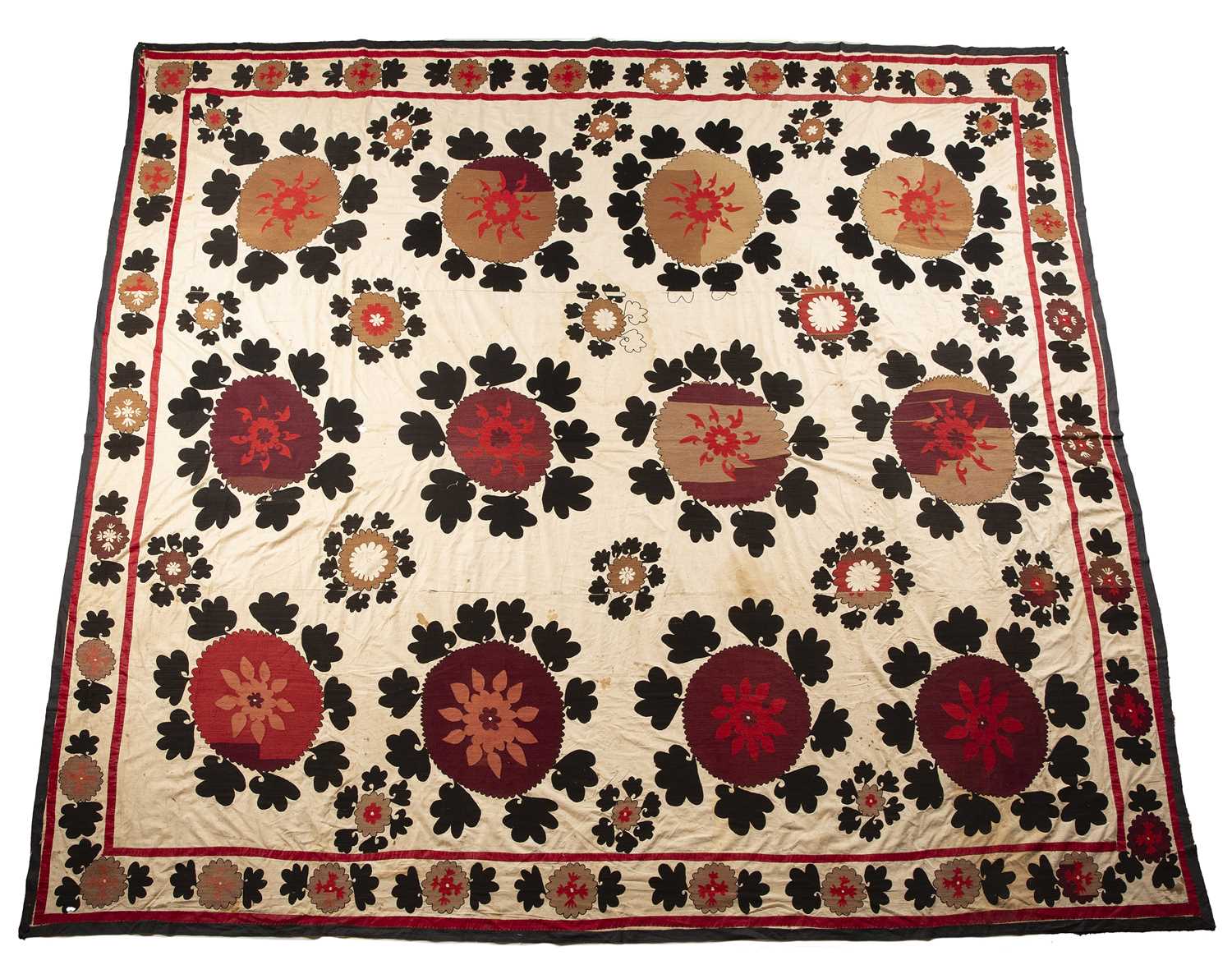 Large suzani Uzbekistan, with foliate designs on an ivory ground, 292cm x 240cm Provenance: The