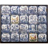 Panel of twenty blue and white and manganese tiles 18th Century, probably Spanish, each painted with