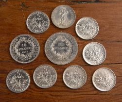 Collection of French coins comprising: 1976 50 Francs coin, 1970 10 Francs coin, two 1960 5 Franc