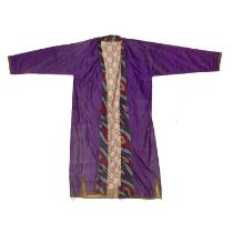 Purple silk chapan pre 1940, bordered with silk ikat and lined with Russian print cotton.
