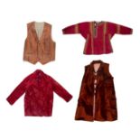 Group of four pieces including a Central Asian red silk and embroidered top, a Hungarian silk