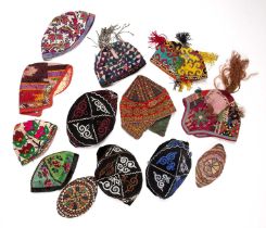 Group of caps Uzbekistan and Central Asia, including a child's hat from the Ersari tribe on the