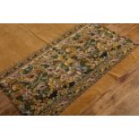 Golden brown rug with floral banner the floral banner with castle architecture and trees, 285cm long