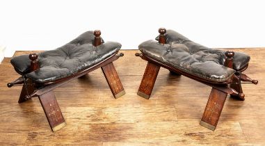 Pair of Benares camel stools Indian, with brass inlay and leather seats, 62cm long With some wear,