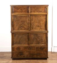 Elm two part tansu Japanese, Meiji period, with sliding cupboard doors and drawers to the base,