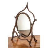 Mahogany dressing mirror with a shaped frame and turned finial, 49cm wide x 73cm high