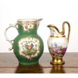 Worcester green ground mask jug with a scrolling handle and gilt details throughout, 20cm high,