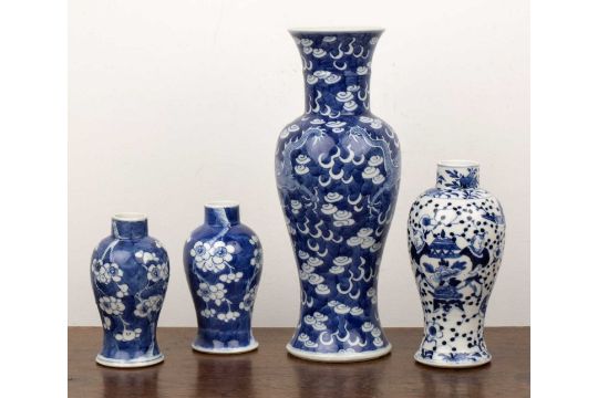 Group of four vases Chinese, 19th Century comprising: a near pair of of blue and white cherry - Image 2 of 3