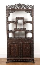 Export hardwood carved cabinet Chinese, 19th Century with open shelves above a cupboard enclosed