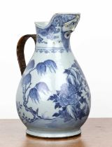 Large porcelain blue and white jug Chinese, 18th Century painted with a rocks, foliage and