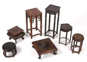 Six various hardwood stands Chinese the largest in the manner of a small urn stand, 40cm high