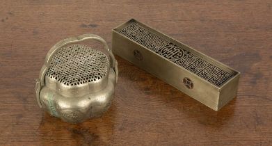 Two metal hand warmers Chinese one of rectangular form with a Shou character, 21cm long x 4.6cm wide