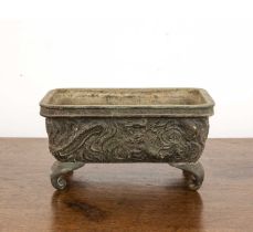 Small rectangular bronze jardinière Chinese, 19th Century with dragons and waves beneath a key