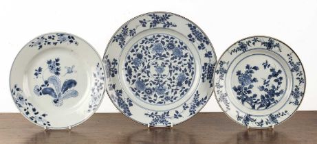 Three blue and white porcelain plates Chinese, 18th Century, the largest painted with chrysanthemums