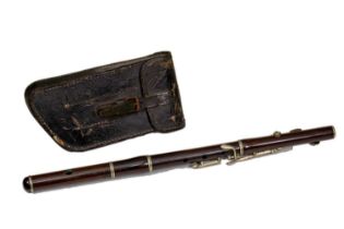 A 19th Century Cocus wood flute 50cm in length, with a leather case. Two surface splits, scratches