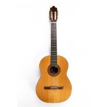 An acoustic guitar with Tunbridgeware style geometric and formal pattern decoration to the soundhole