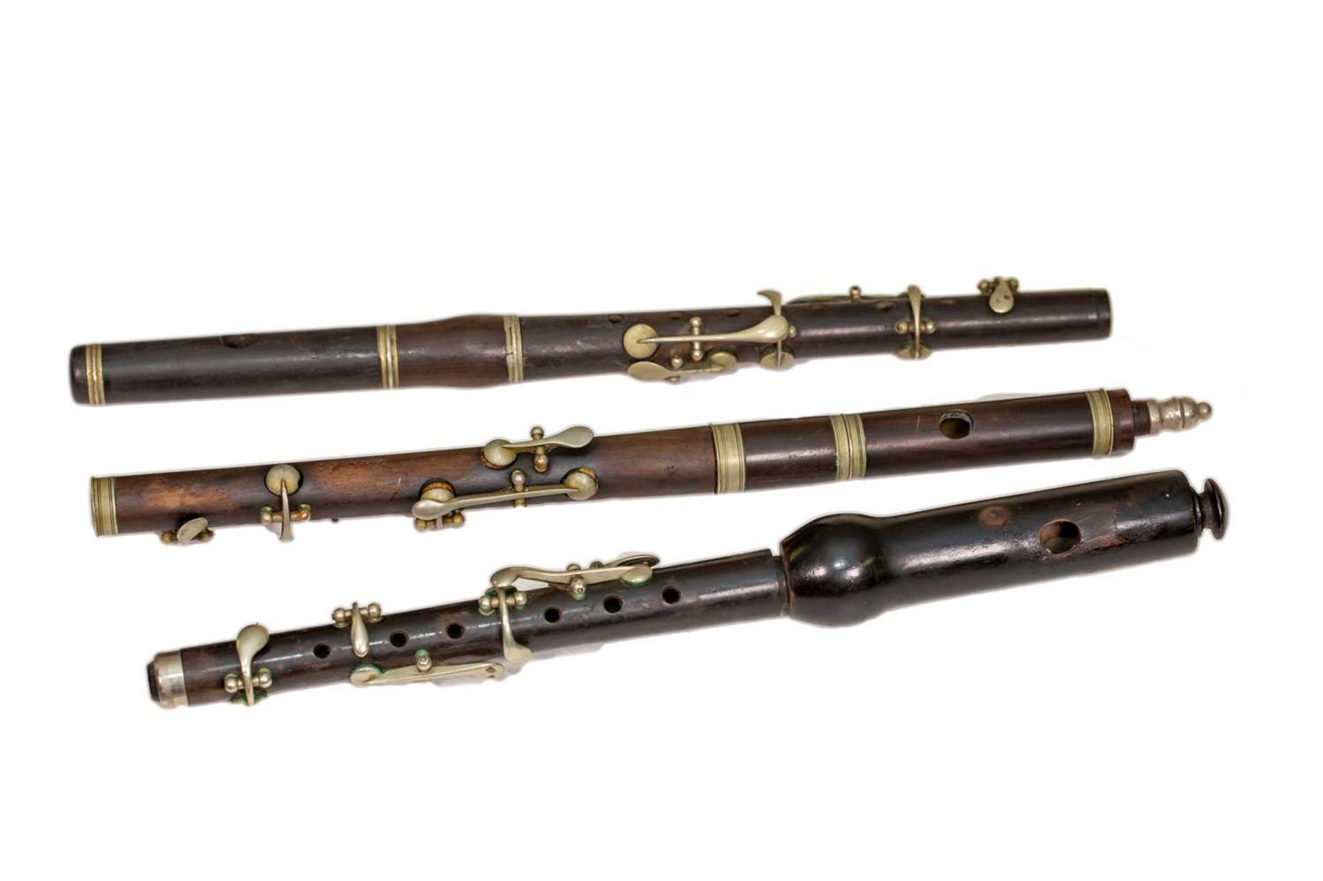 A late 19th century piccolo by J Wallis 32.5cm in length together with two further piccolos (3)