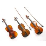 A collection of six modern violins, various makes, some with bows, all cased; together with a