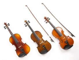 A collection of six modern violins, various makes, some with bows, all cased; together with a