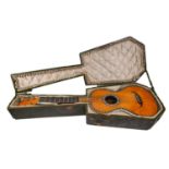 An early 19th century French classical guitar, stamped 'M.C. Mousset à Paris' to the inside, the