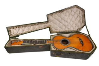 An early 19th century French classical guitar, stamped 'M.C. Mousset à Paris' to the inside, the