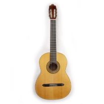 An acoustic guitar with Tunbridgeware style geometric and formal pattern decoration to the soundhole