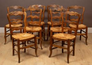 A set of eight fruitwood farmhouse chairs