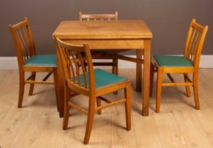 A 'Utility' fold over dining table and chairs