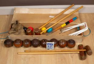 A Townsend Croquet Ltd croquet set together with a set of eight wooden lawn bowls