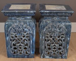 A pair of Eastern glazed plinths