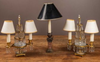 A pair of brass and lustre electrically converted candelabra; together with a table lamp