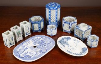 A collection of blue and white candle holders