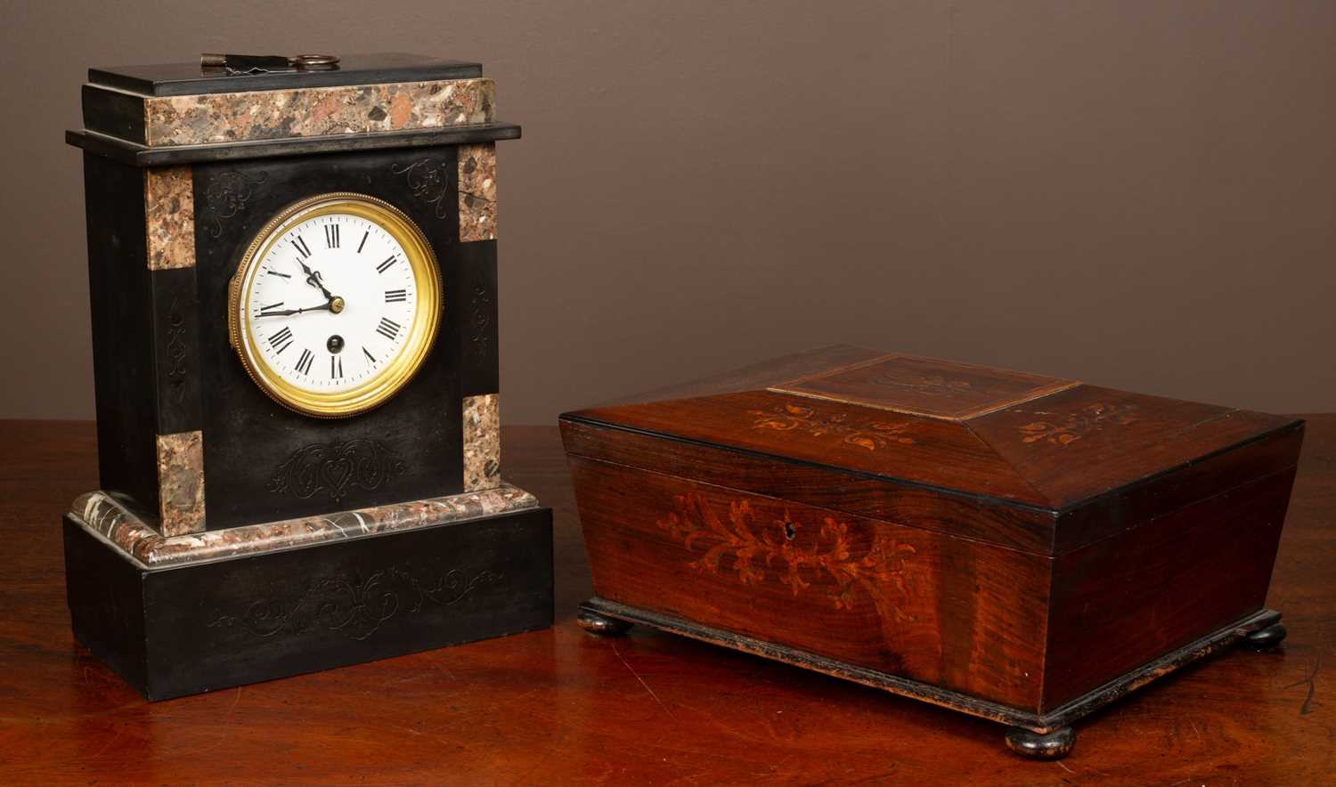 A slate mantel clock together with a rosewood tea caddy