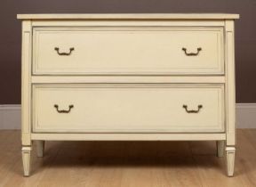 A cream painted chest of two long drawers