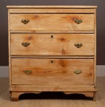 A 20th century pine chest of three long drawers