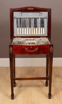 A mahogany canteen of silver plated flatware