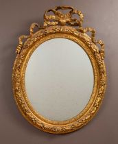 A gilt framed circular wall mirror