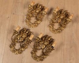 A set of four Italian gilt wooden wall lights