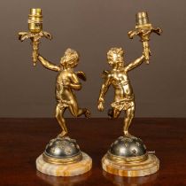 A pair of French gilt metal table lamps