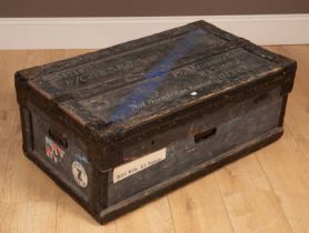 A wooden framed steamer trunk