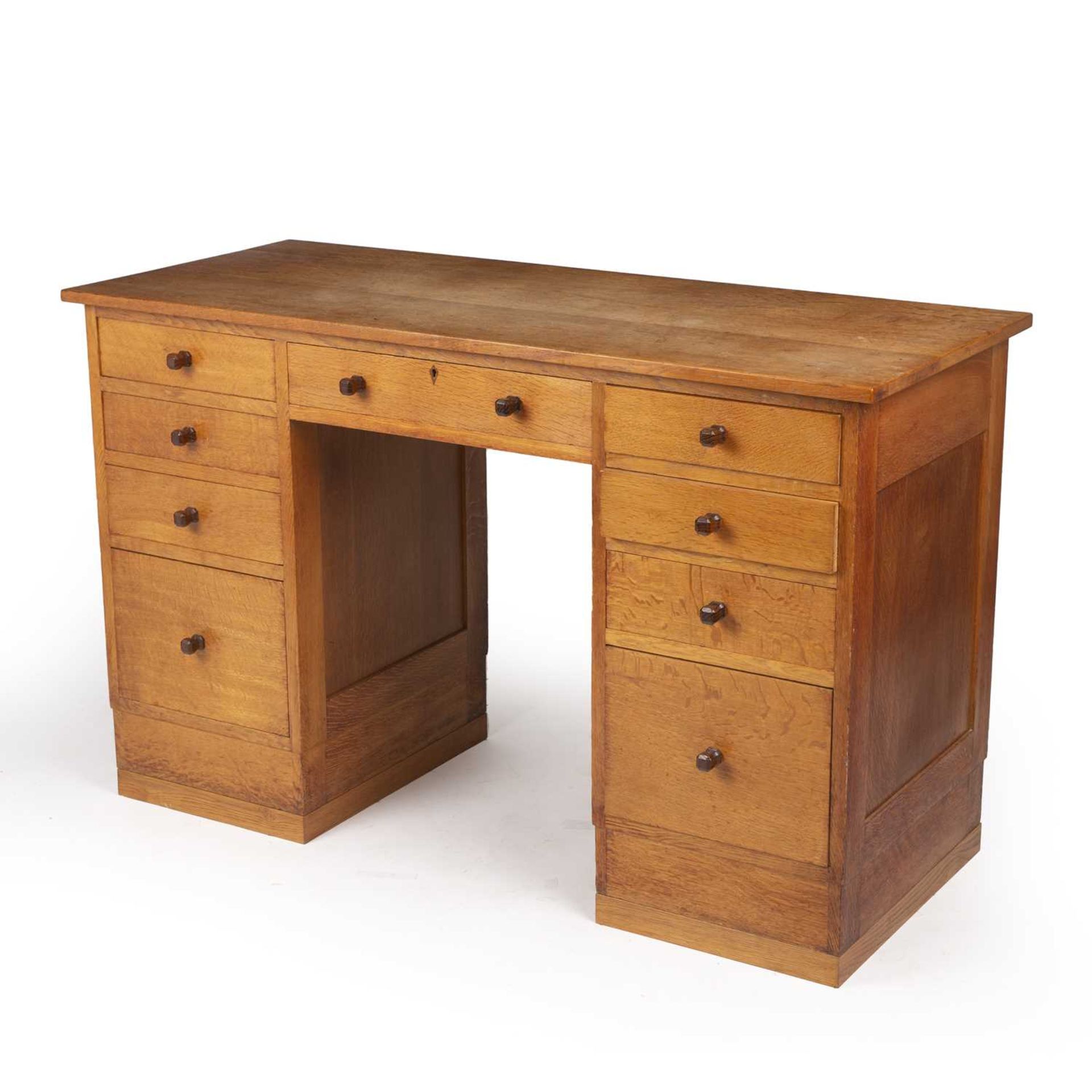 Gordon Russell (1892-1980) Desk, circa 1930 oak, with nine fitted drawers, each with carved - Image 3 of 5