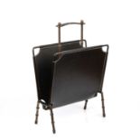 Jacques Adnet (1900-1984) Magazine rack, circa 1950 leather with metal supports 59cm high, 43cm