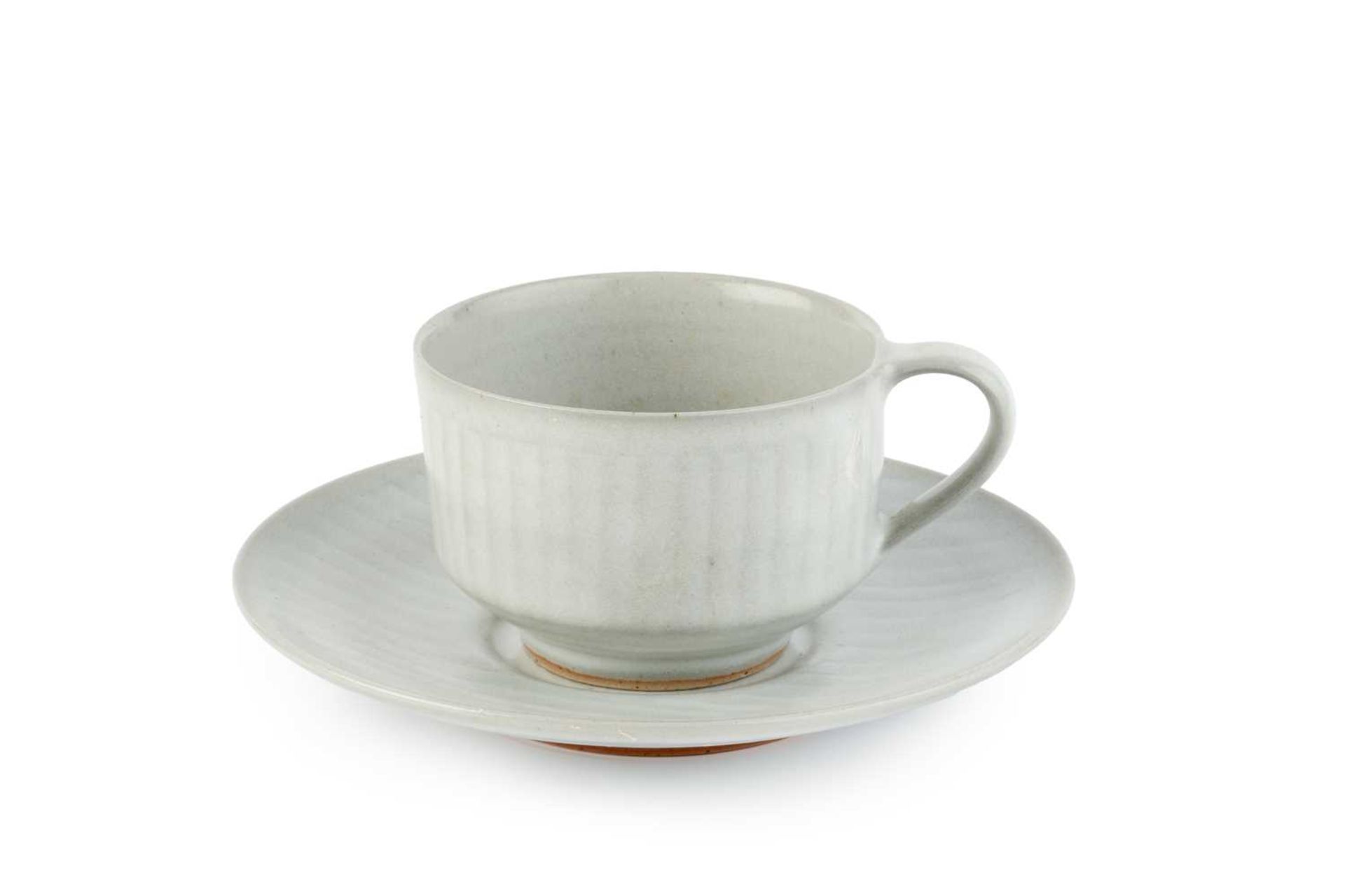 Rupert Spira (b.1960) Cup and saucer pale glaze and with a faint incised pattern both with impressed