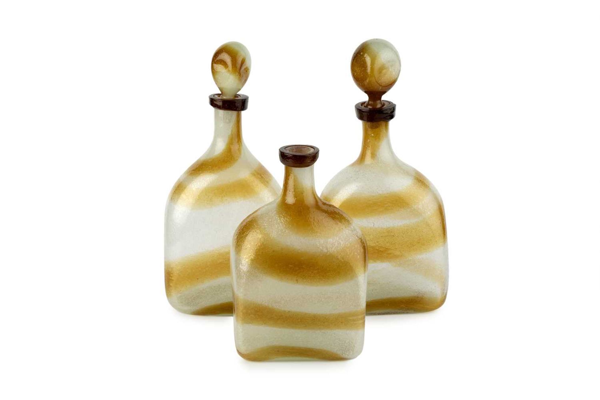 Attributed to Arte Vetraria Muranese (AVEM) Three Pulegoso glass bottles, circa 1950 clear and brown